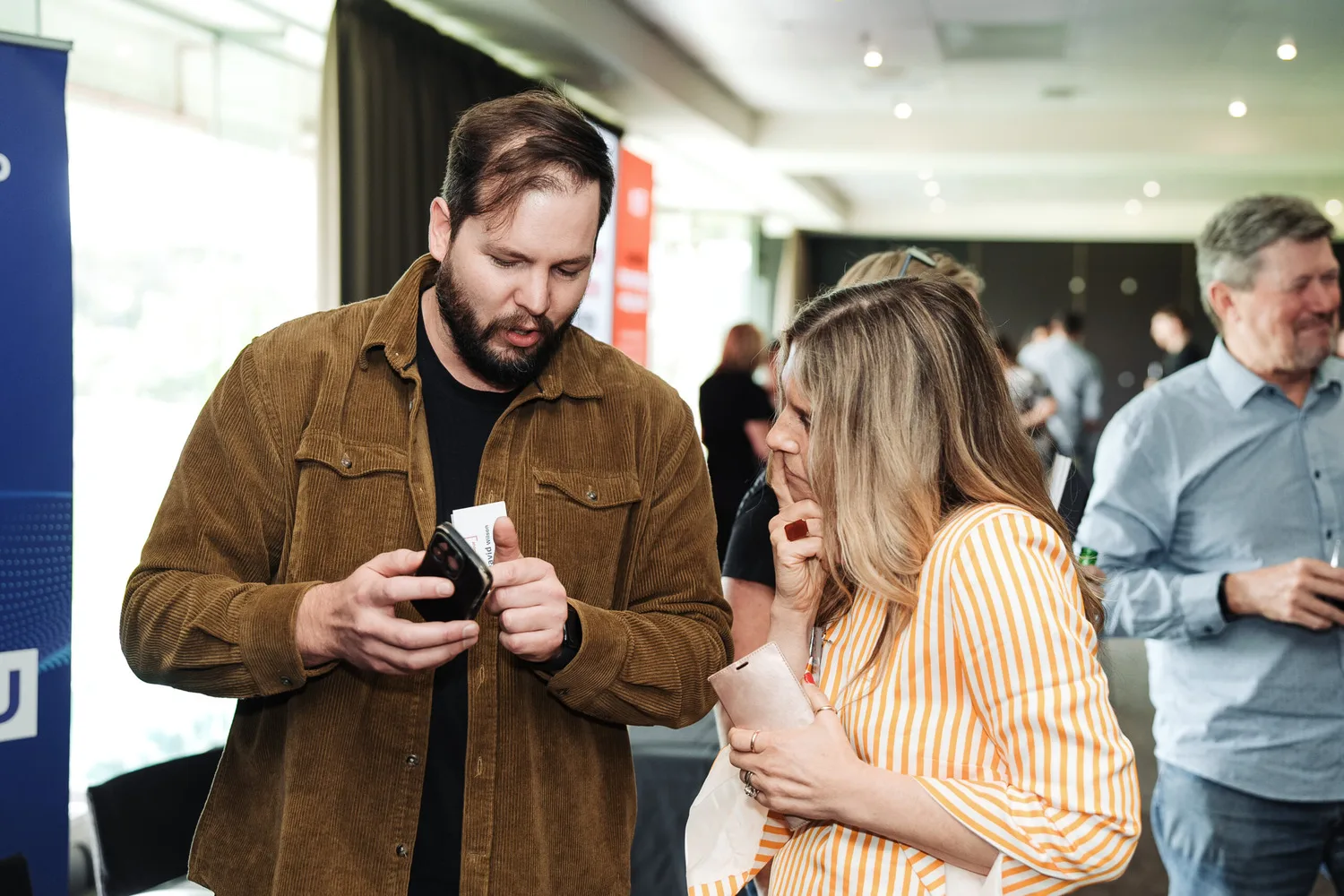 The iT360 team meeting with clients at a business event